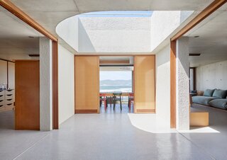 A large open skylight floods the heart of the home with natural light, even in winter months, and creates an interesting play between interior and exterior space in the main living area.