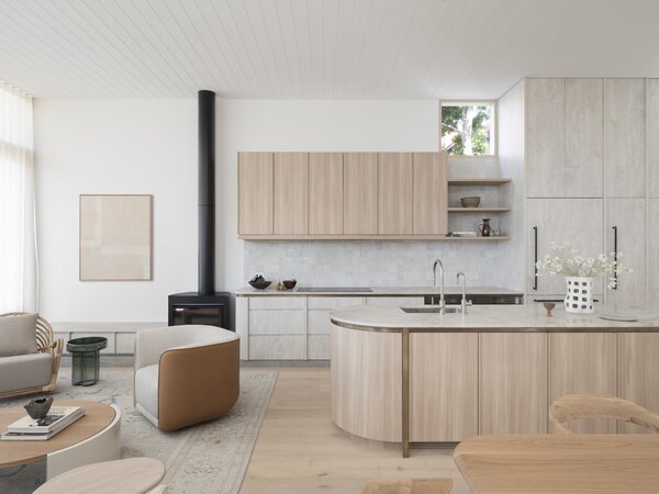 <span style="font-family: Theinhardt, -apple-system, BlinkMacSystemFont, &quot;Segoe UI&quot;, Roboto, Oxygen-Sans, Ubuntu, Cantarell, &quot;Helvetica Neue&quot;, sans-serif;">View into the open-plan kitchen and living room in the bungalow's newly built back end. "T</span><span style="font-family: Theinhardt, -apple-system, BlinkMacSystemFont, &quot;Segoe UI&quot;, Roboto, Oxygen-Sans, Ubuntu, Cantarell, &quot;Helvetica Neue&quot;, sans-serif;">he floor is oak from Tongue and Groove, and the cabinetry is actually a polytech product that's really practical, especially for kitchens because it's harder to damage than veneer,