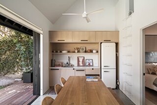 The ADU's kitchenette is tucked into one side of the structure, with a ladder leading to a carpeted playroom for the kids. "It's a great example of a family home that doesn't always look like it,