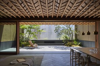 "The effect of the plantings on the terrace is enormous,” reflects the couple. “Not only do the branches and formations give a sense of the four seasons, but the way it looks from the living room contributes to a sense of calmness. It gives the illusion that we are viewing art."