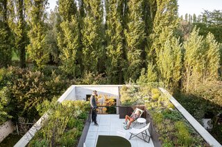 A vast terrace overlooks a nearby park, while the ground floor patio (connected to Vanbesien’s office) opens up to a garden.