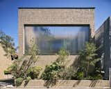 In This Tokyo Home, a Secret Garden Thrives Behind a Cascade of Glass