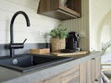 The kitchen comes with all the cabinetry installed, as a well as a Franke sink and a faucet from Grohe.