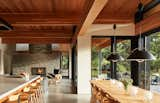 The great room includes a U-shaped kitchen island designed for the tradition of family meal preparation. "The joy that the family experiences while preparing a meal together at the U-shaped kitchen island, facing out to the rolling hills beyond, is particularly heartwarming," says architect Meelena Oleksiuk Turkel.&nbsp;